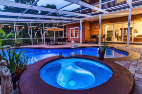 4-bdrm Pool House Paradise 1 block to beach with salt water pool and hot tub